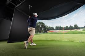 Person playing golf in VR simulator